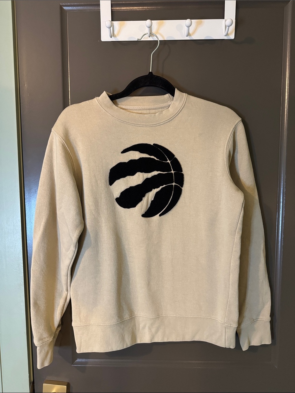 NBA Youth size large Beige Crewneck Sweatshirt with Black Raptors Logo